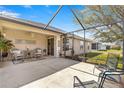 Relax on this airy screened-in patio with neutral decor and backyard views at 12225 Se 173Rd Pl, Summerfield,, FL 34491