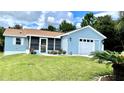 Charming single-story home with screened in porch and attached one car garage at 1416 Lindsey Ln, The Villages, FL 32159