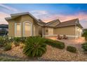 Beautiful home featuring a well-maintained front yard with a lovely entrance and outdoor seating at 2050 Biller Cir, The Villages, FL 32163