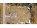 An aerial view of the home with a large lot and a fenced yard at 5890 Sw 167Th Pl, Ocala, FL 34473