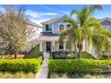 Beautiful two-story home featuring a welcoming front porch and well-maintained landscaping at 11090 Silver Surfer Aly, Winter Garden, FL 34787