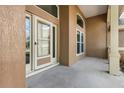 Inviting covered porch with exterior door, a perfect welcome to this home at 17408 Tailfeather Ct, Clermont, FL 34711