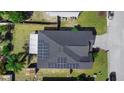 Aerial view of the house roof with solar panels, surrounded by well-kept landscaping and green space at 1917 Emily Blvd, Winter Haven, FL 33884