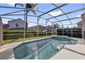 Enjoy the backyard pool area complete with screened enclosure for outdoor pleasure at 231 Brunello Dr, Davenport, FL 33897