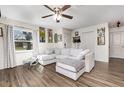 Bright living room featuring a sectional sofa, a ceiling fan, and stylish decor at 2803 Joleen Dr, Eustis, FL 32726