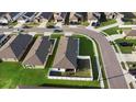 Aerial view of homes with fenced backyards in a well-maintained residential area at 440 Kensington View Dr, Winter Haven, FL 33880