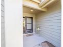 Inviting covered front porch with neutral siding and simple decor creates a warm welcome at 480 Ne 45Th Ter, Ocala, FL 34470