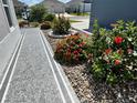 Beautiful, colorful landscaping surrounds this charming home at 511 Van Deen Pl, The Villages, FL 34762