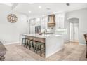 Spacious white kitchen featuring a large center island, stainless appliances, and modern finishes at 6206 Ocilla Loop, Clermont, FL 34714