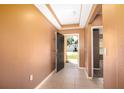 View of the foyer leading to the rest of the house, with tile flooring and a neutral color scheme at 1041 Bradford Ridge Dr, Leesburg, FL 34748