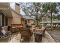 Outdoor space featuring a bar, seating, and a wooden deck, perfect for entertaining in a relaxed setting at 11415 Palmetto Dr, Tavares, FL 32778