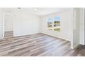 Inviting living room with modern flooring and natural light from the windows at 13877 County Road 109F, Lady Lake, FL 32159