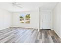 Bright living room featuring modern flooring and a welcoming entryway at 13877 County Road 109F, Lady Lake, FL 32159