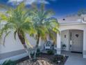 Inviting front entry featuring a decorative front door and outdoor seating at 1828 Augustine Dr, The Villages, FL 32159