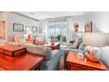 Comfortable living room featuring plush seating and sliding glass doors leading to the outdoors at 26821 Augusta Springs Cir, Leesburg, FL 34748