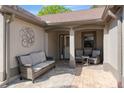 Inviting front porch with brick pavers and comfortable seating, perfect for relaxing and enjoying the outdoors at 314 Chula Vista Ave, Lady Lake, FL 32159