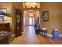 Grand entryway featuring tiled floors, decorative niches, and views to the living space at 3733 Plantation Blvd, Leesburg, FL 34748