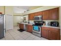 Spacious kitchen with stainless steel appliances and ample counter space for meal preparation at 3773 Eversholt St, Clermont, FL 34711