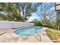 Tranquil swimming pool with a calming backyard setting, perfect for relaxing and escaping the day's worries at 402 Firewood Ave, Eustis, FL 32726