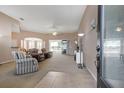 Inviting living room featuring an open floor plan with neutral colors and lots of natural light at 5824 Blue Savannah Dr, Leesburg, FL 34748