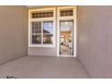 Enclosed outdoor patio with a view into the home with a screened window at 5824 Blue Savannah Dr, Leesburg, FL 34748