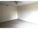 A spacious living room features neutral colored walls and floors at 616 N Hartley Cir, Deltona, FL 32725