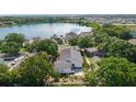 Aerial view of the home near a lake, showing the beautiful surroundings and neighborhood at 1013 Lake Elsie Dr, Tavares, FL 32778