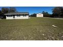 Single story home on large lot with detached garage/workshop space at 11701 Layton St, Leesburg, FL 34788