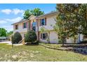 Spacious two-story home boasts a brick entryway and mature landscaping at 16017 Harbar Oaks Dr, Montverde, FL 34756