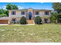 Charming two-story home boasts an inviting entrance and lush front yard at 16017 Harbar Oaks Dr, Montverde, FL 34756