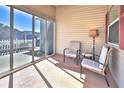Cozy screened-in patio featuring comfortable seating and ample natural light at 1805 Endsley Ct, The Villages, FL 32162