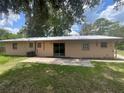 Spacious backyard with a concrete patio, perfect for outdoor entertaining and relaxation at 3309 Ne 16Th Ave, Ocala, FL 34479