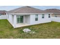 A home's exterior rear view features a covered patio and a grassy yard, perfect for outdoor enjoyment at 37031 Lake Overlook Dr, Grand Island, FL 32735