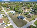 Wide aerial view of single story home featuring a large yard and neighborhood setting at 4857 Se 137Th Pl, Summerfield, FL 34491