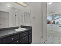 Bathroom featuring a shower, bathtub, and a vanity with a large mirror for enhanced functionality at 5402 Rosewall Cir, Leesburg, FL 34748