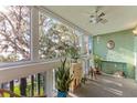 Comfortable sun room with beautiful scenic views, perfect for relaxation and enjoying the outdoors at 601 N Mcdonald St # 208, Mount Dora, FL 32757