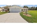Lovely single-story home featuring an attached garage and a well-maintained lawn at 6022 Wilander St, Leesburg, FL 34748