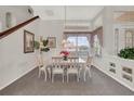 Cozy dining room with a large window and elegant furnishings at 6122 Sailboat Ave, Tavares, FL 32778
