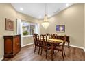 Formal dining room boasting hardwood floors, recessed lighting, and a chandelier at 11396 Se 178Th Pl, Summerfield, FL 34491