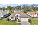 Charming single-Gathering home with a well-kept lawn, complemented by lush landscaping and a welcoming two-car garage at 11684 Sw 72Nd Cir, Ocala, FL 34476