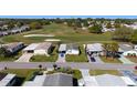 Aerial view of the home in a well-maintained community with a golf course nearby at 1510 E Schwartz Blvd, The Villages, FL 32159