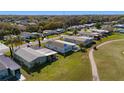 Birds-eye view of the home in a quiet neighborhood setting and convenient golf course access at 1510 E Schwartz Blvd, The Villages, FL 32159
