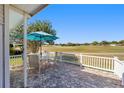 Inviting outdoor patio featuring comfortable seating and scenic golf course views at 1510 E Schwartz Blvd, The Villages, FL 32159