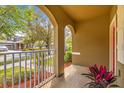 Inviting porch featuring an archway and a view of the neighborhood at 15475 Camp Dubois Cres, Winter Garden, FL 34787