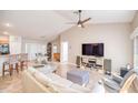 Bright living room featuring neutral walls, a ceiling fan, and tile flooring throughout at 181 Sutter Dr, Clermont, FL 34711