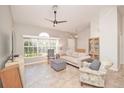 Cozy living room with large window providing ample natural light and comfortable seating arrangements at 181 Sutter Dr, Clermont, FL 34711