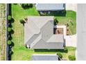 Overhead view of a house with a well-kept roof, manicured lawn, and neatly arranged landscaping at 2188 Gordon Path, The Villages, FL 32163