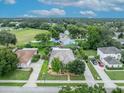 Aerial view of a suburban neighborhood featuring well-maintained homes and mature trees at 257 Winding Cove Ave, Apopka, FL 32703