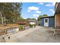 Backyard featuring wood deck, above ground pool, storage building, and landscaping at 33311 Green Rd, Leesburg, FL 34788