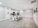 A modern kitchen with stainless steel appliances and granite countertops at 717 Robin Ct, Kissimmee, FL 34759